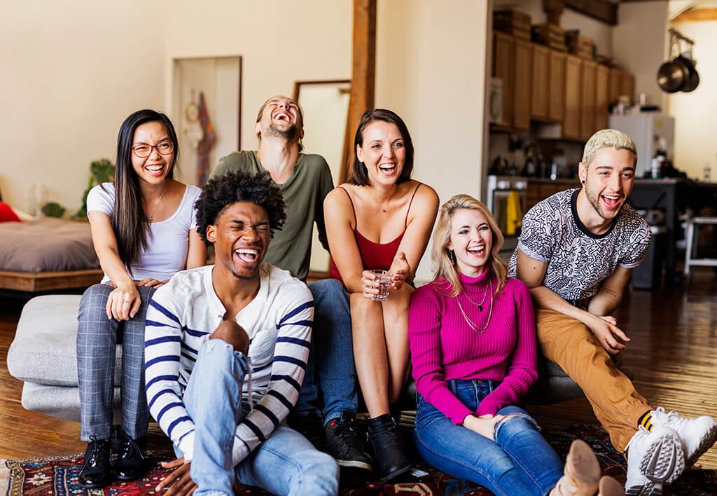 Shared Expenses | Multicultural College Students watching a sports game on TV