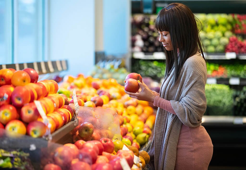 African American Woman Shopping Discount Produce, Grocery Store