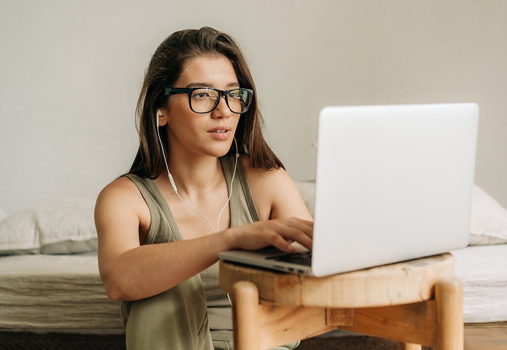 Female College Student on Laptop - Best Study Spots Near West Chester University