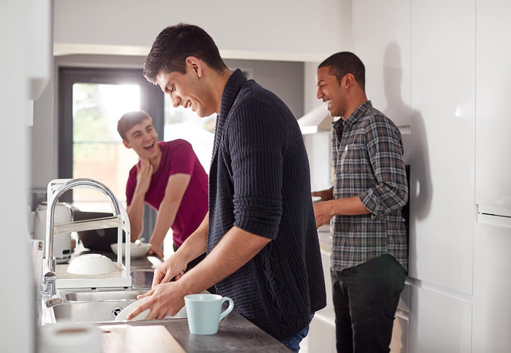 Shared Space Apartment | College Students Washing Dishes Together by Sink